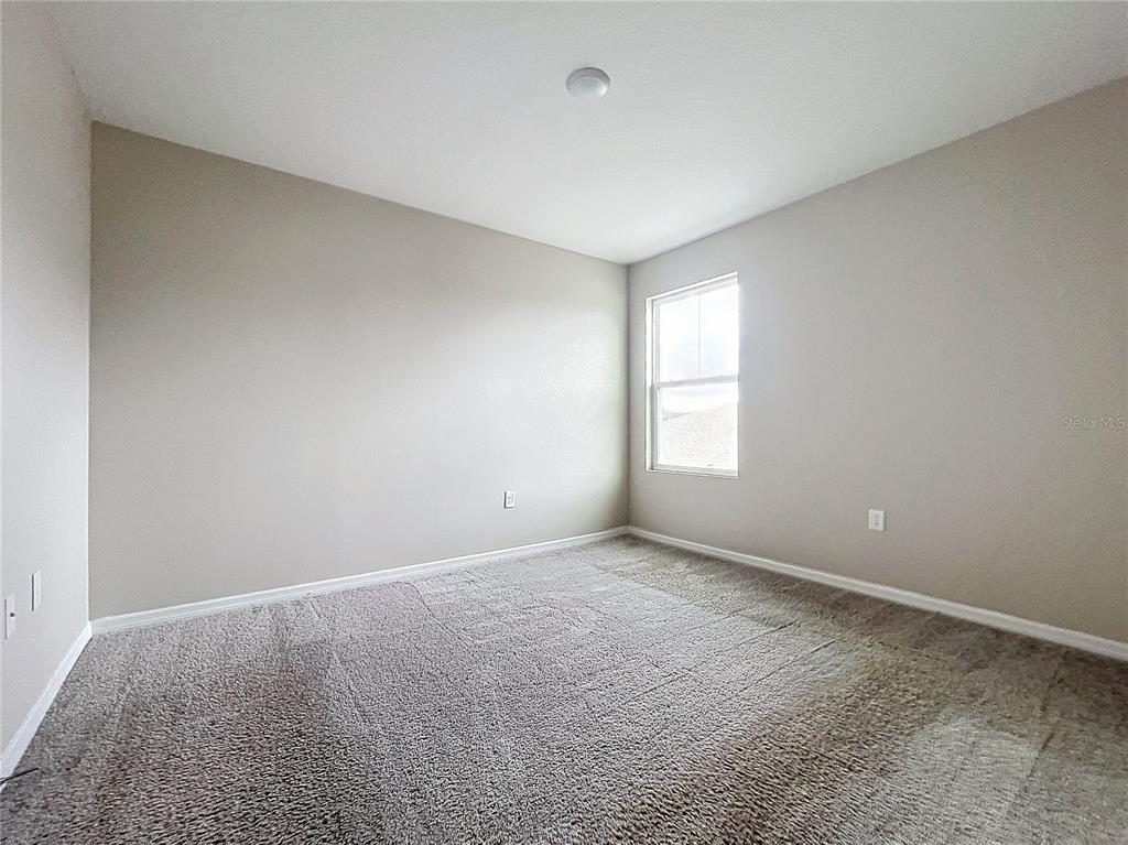 1404 Axel Circle Winter Haven, FL 33880 - Photo 17 of 21 a view of an empty room with a window