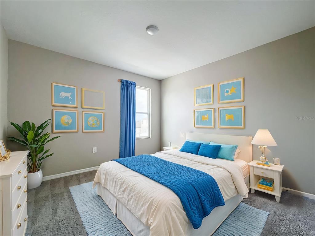 1404 Axel Circle Winter Haven, FL 33880 - Photo 18 of 21 a bedroom with a large bed and a couch