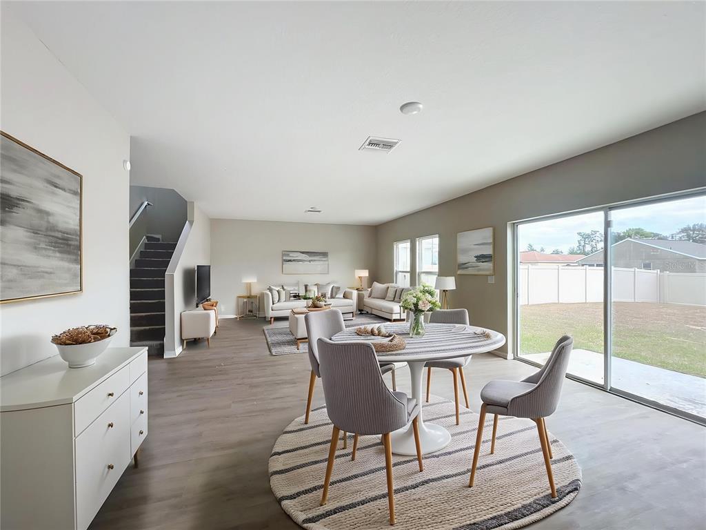 1404 Axel Circle Winter Haven, FL 33880 - Photo 3 of 21 a view of a dining room with furniture window and outside view