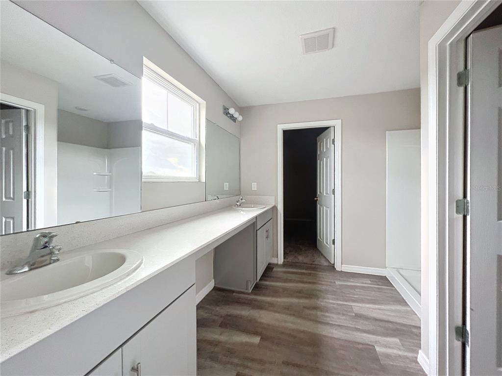 1404 Axel Circle Winter Haven, FL 33880 - Photo 9 of 21 a bathroom with a sink and a window