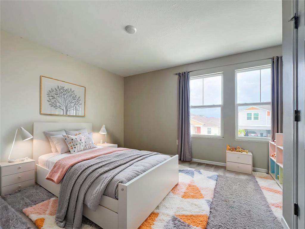 1404 Axel Circle Winter Haven, FL 33880 - Photo 10 of 21 a bedroom with a bed and a window