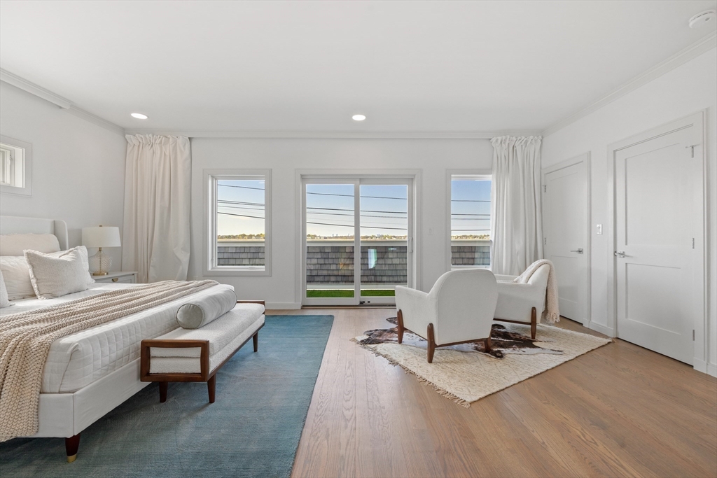 137 Wessagussett Road Weymouth, MA 02191 - Photo 14 of 32 a living room with furniture hard wood floor and a table