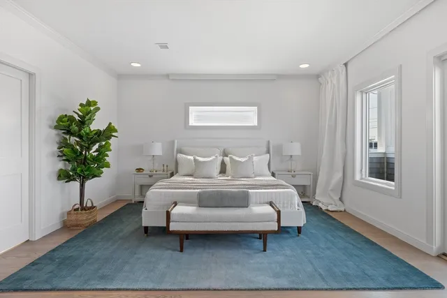 an aerial view of residential houses with city view and a street view