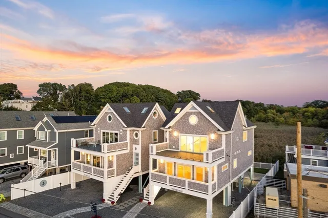 a front view of houses with a street