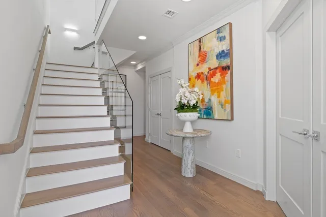 a view of entryway with stairs and wooden floor