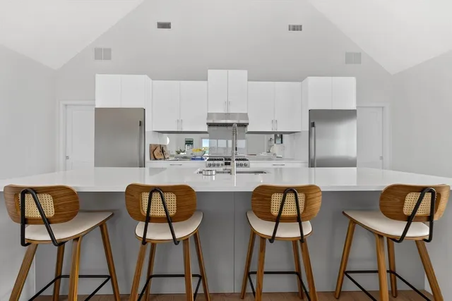 a bathroom with a toilet sink and shower