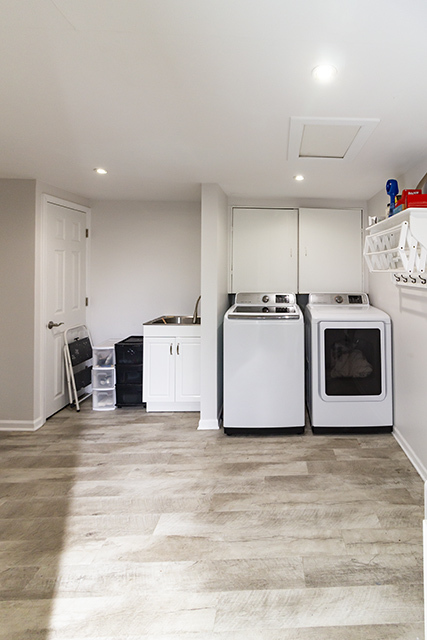 936 Chase Court Gurnee, IL 60031 - Photo 11 of 15 a kitchen with stainless steel appliances kitchen island sink refrigerator and white cabinets