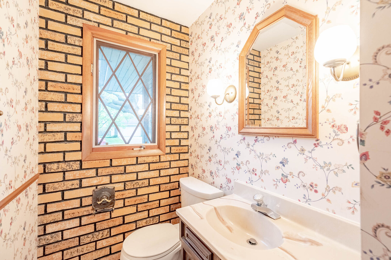 765 Algona Avenue Elgin, IL 60120 - Photo 11 of 13 a bathroom with a sink a toilet and shower curtain