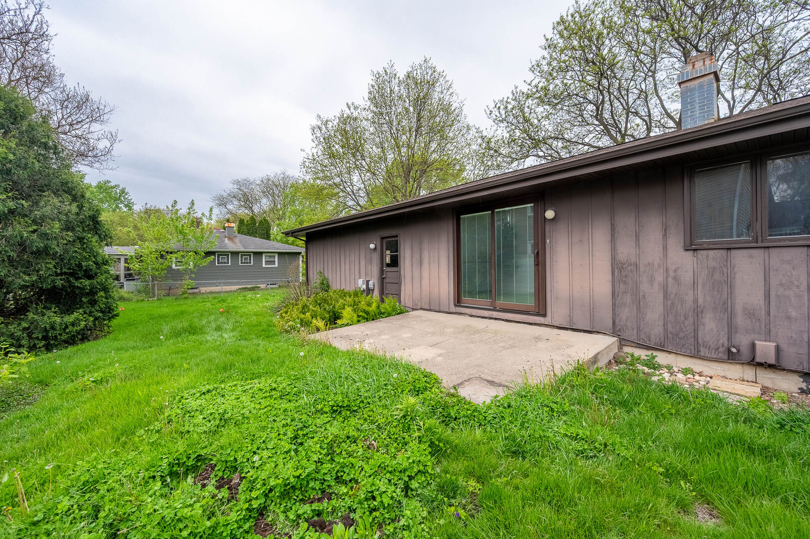 765 Algona Avenue Elgin, IL 60120 - Photo 12 of 13 a backyard of a house with lots of green space