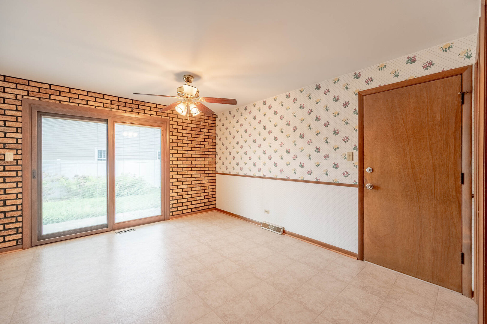 765 Algona Avenue Elgin, IL 60120 - Photo 2 of 13 a view of an empty room with a window