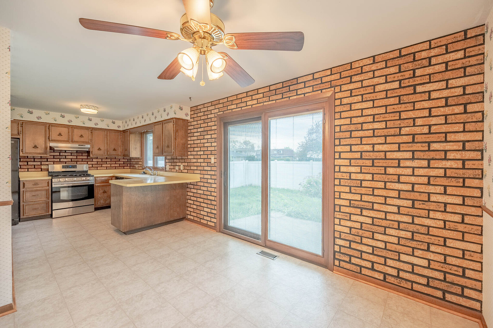 765 Algona Avenue Elgin, IL 60120 - Photo 3 of 13 a view of a kitchen with furniture and a kitchen