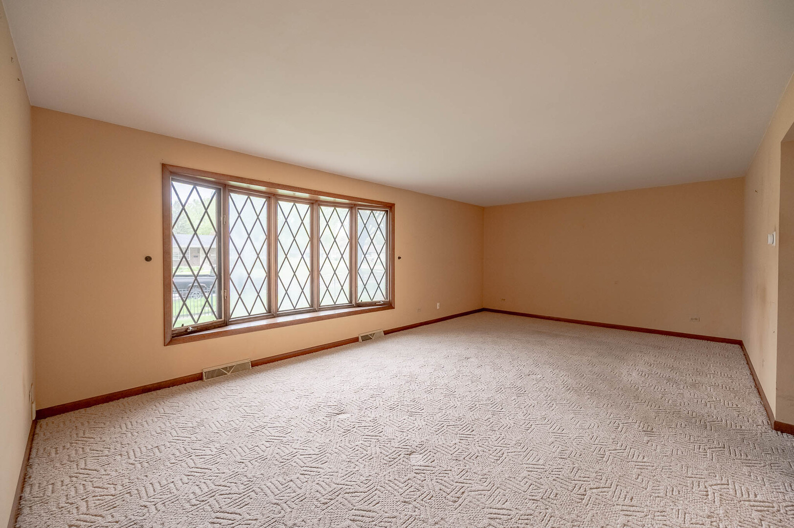 765 Algona Avenue Elgin, IL 60120 - Photo 6 of 13 an empty room with windows