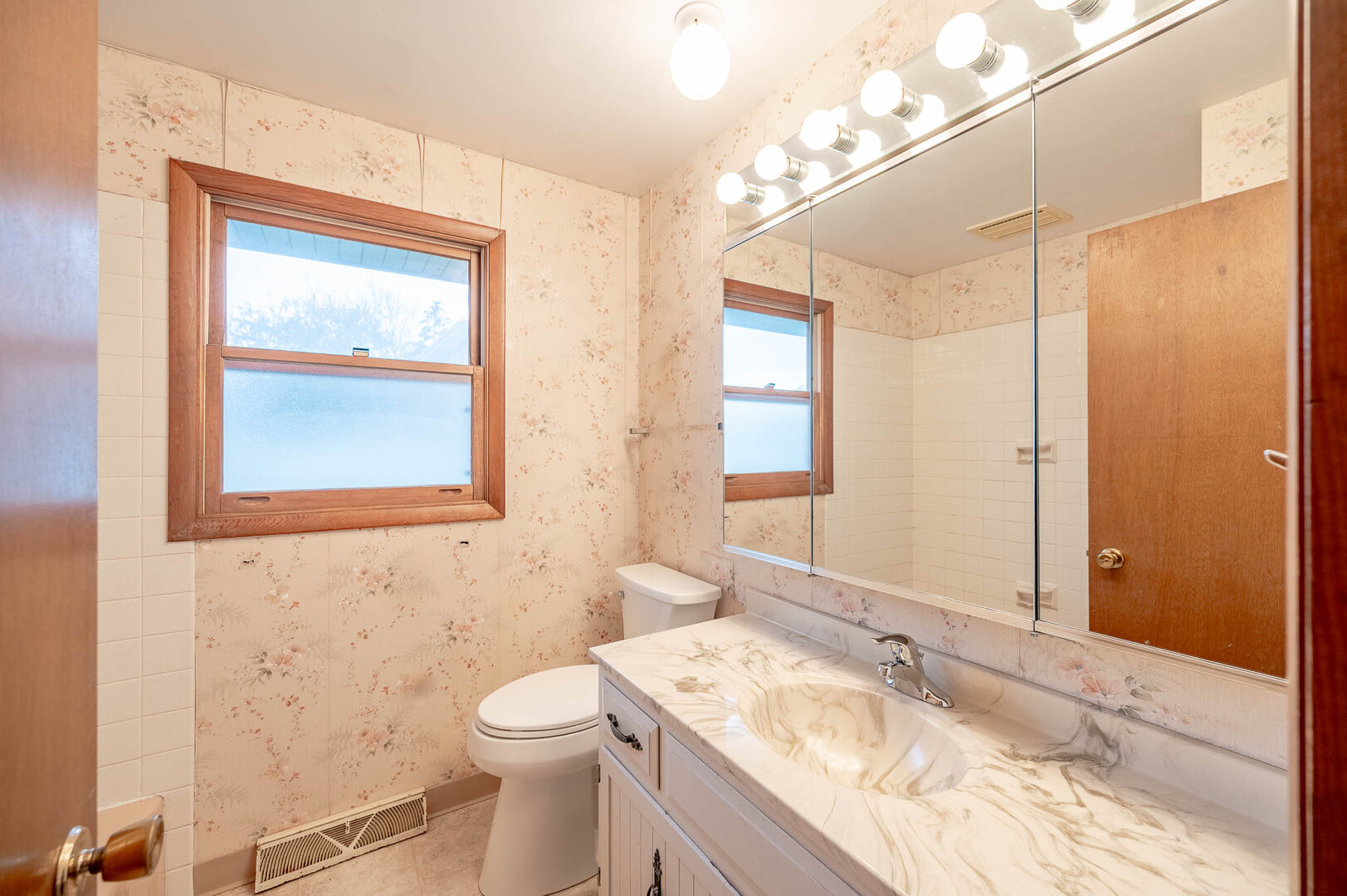 765 Algona Avenue Elgin, IL 60120 - Photo 10 of 13 a bathroom with a granite countertop sink toilet and shower