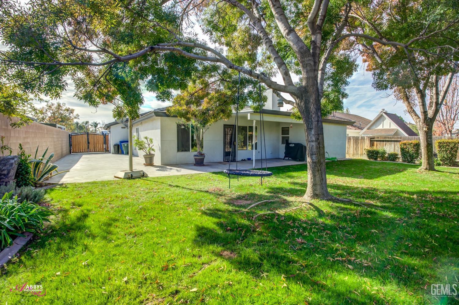 Undisclosed Address Bakersfield, CA 93312 - Photo 4 of 26 a front view of house with yard and green space