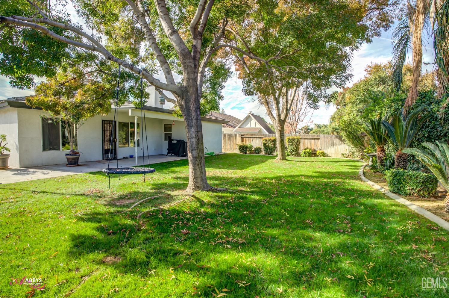Undisclosed Address Bakersfield, CA 93312 - Photo 8 of 26 a view of a house with a backyard