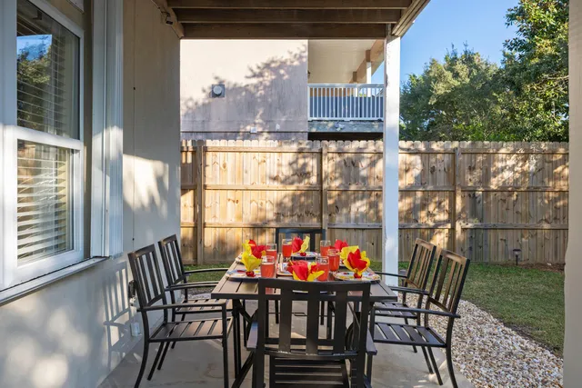 a outdoor dining space with furniture and outdoor view
