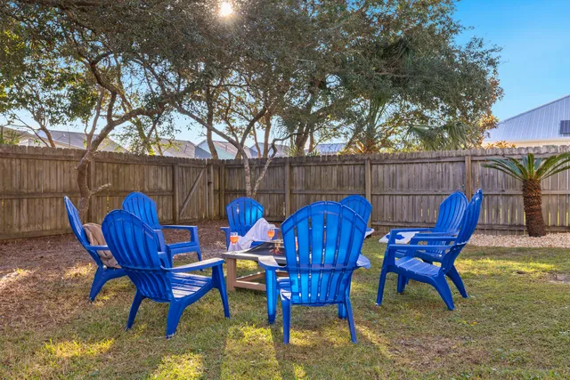 a view of a house with backyard porch and sitting area
