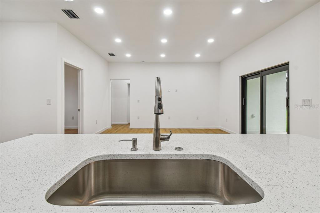 406 Border Street Port Charlotte, FL 33953 - Photo 7 of 20 a view of a kitchen island a sink and dishwasher