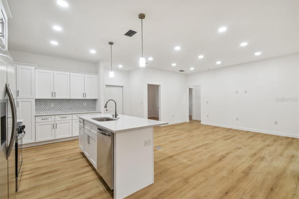 406 Border Street Port Charlotte, FL 33953 - Photo 9 of 20 a kitchen with a sink and cabinets