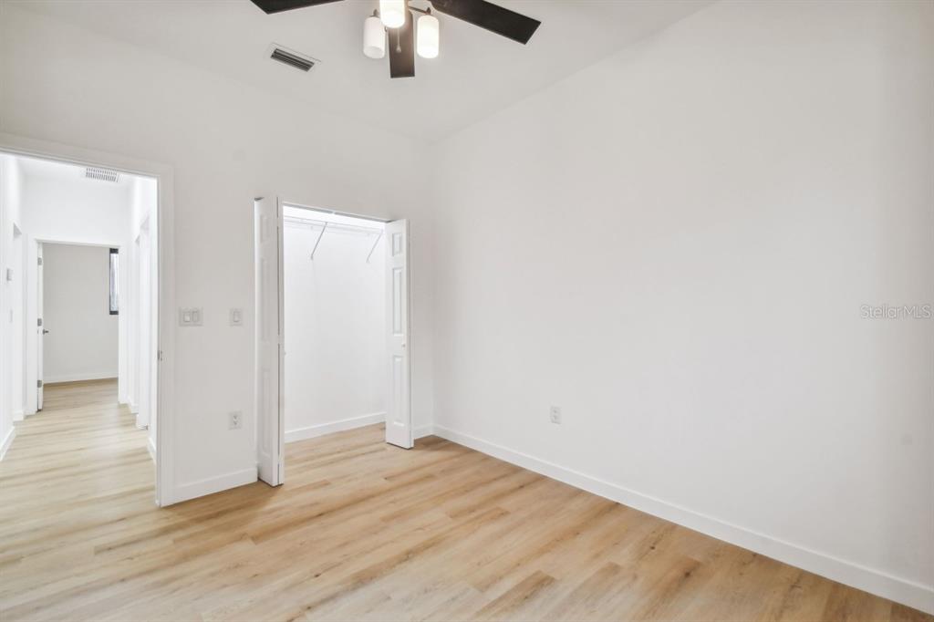 406 Border Street Port Charlotte, FL 33953 - Photo 10 of 20 wooden floor in an empty room