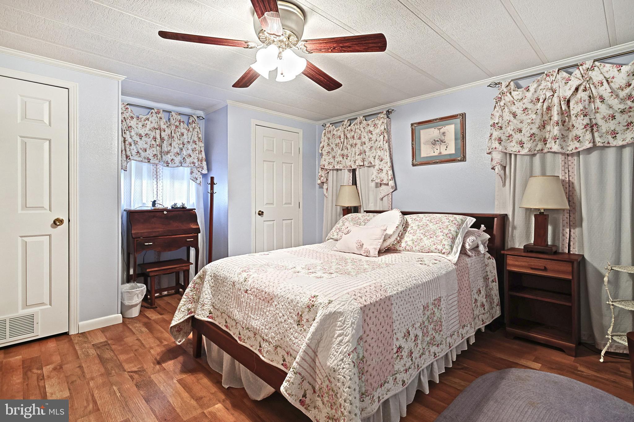 95 Sechrist Flat Road Felton, PA 17322 - Photo 21 of 45 a bedroom with a bed and a chandelier