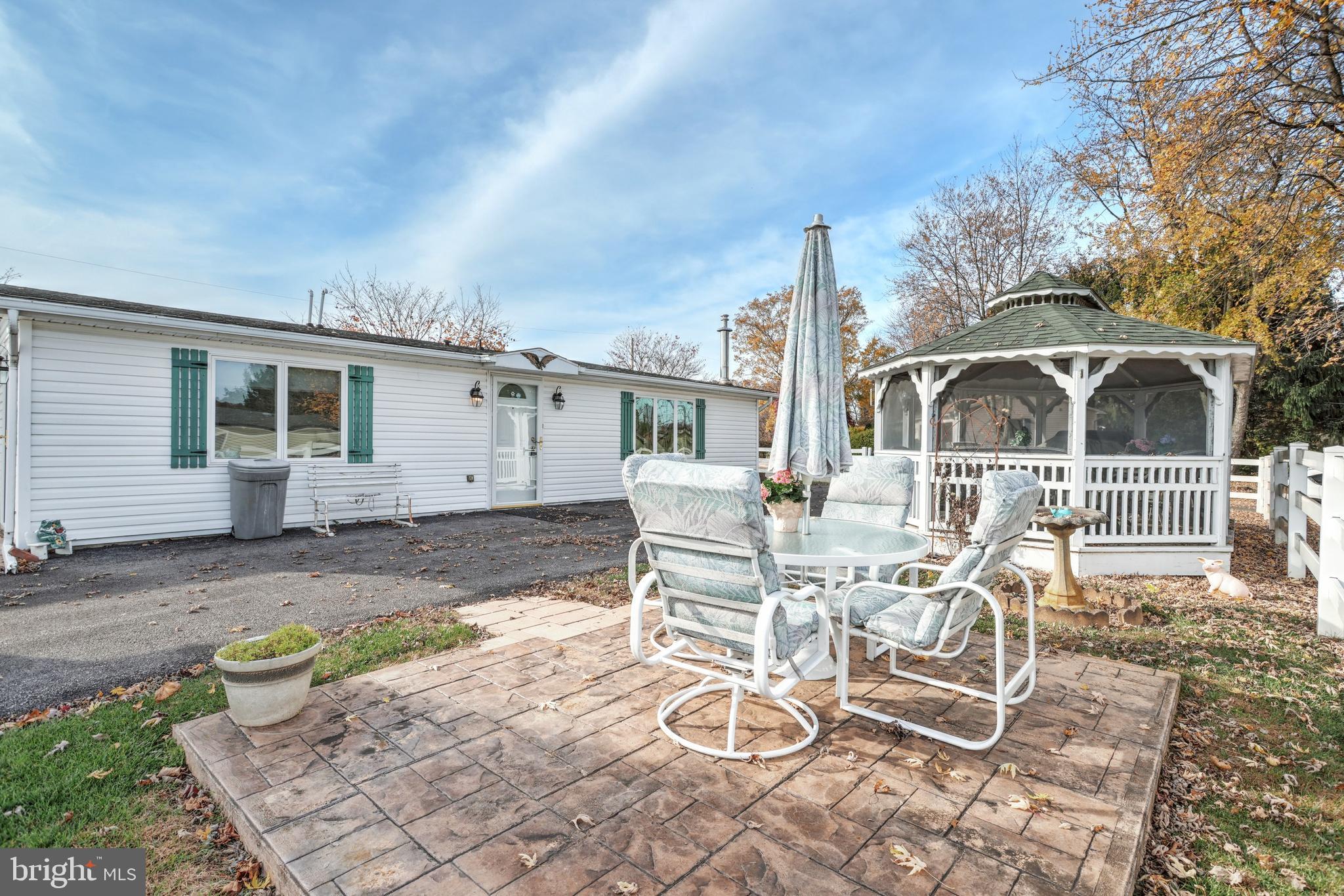 95 Sechrist Flat Road Felton, PA 17322 - Photo 26 of 45 a view of a patio with table and chairs with wooden fence