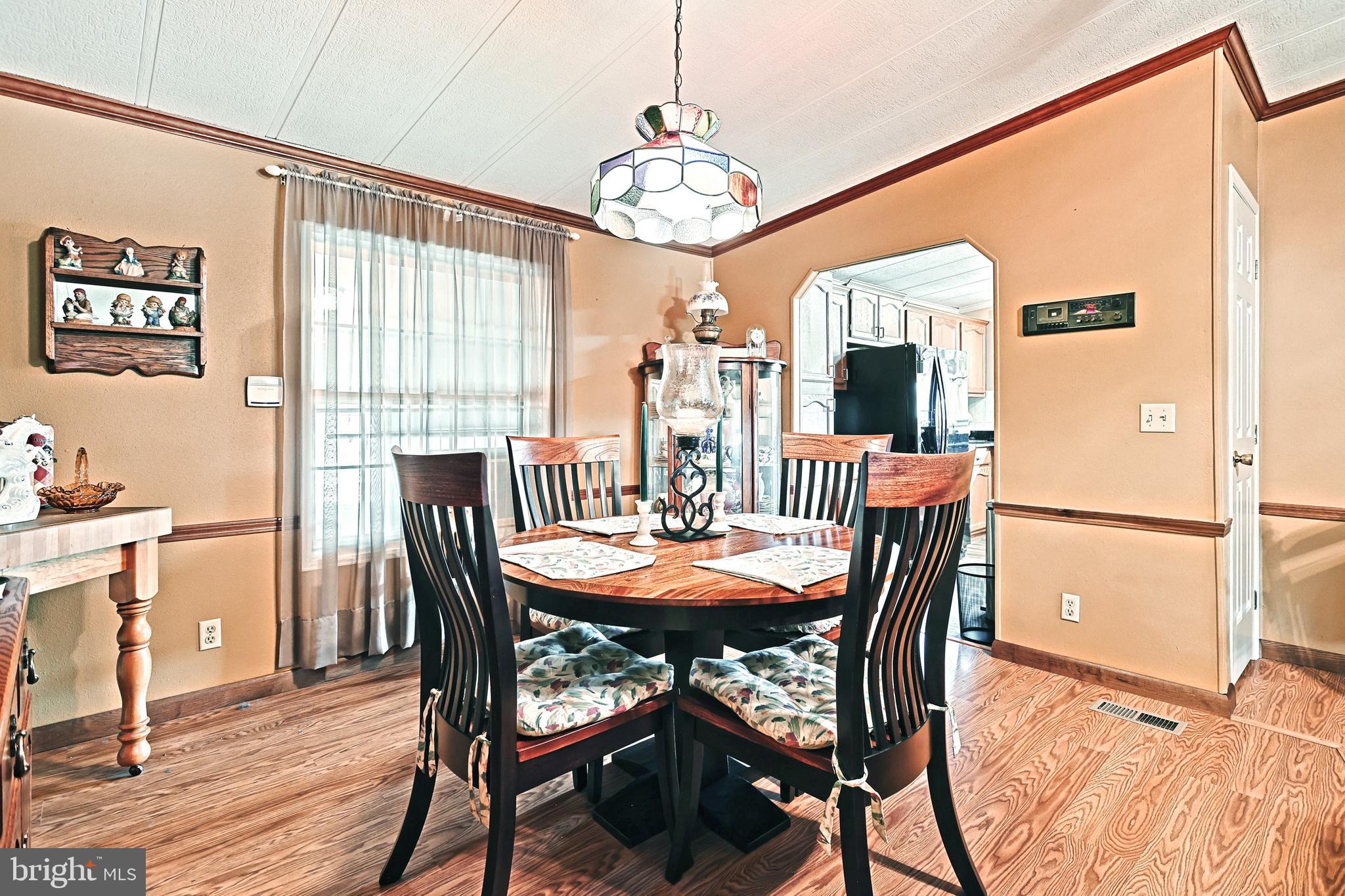 95 Sechrist Flat Road Felton, PA 17322 - Photo 10 of 45 a view of a dining room with furniture window and wooden floor