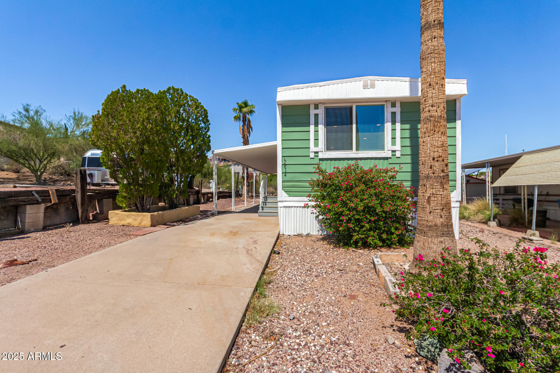 12814 North 19th Place, Unit 19 Phoenix, AZ 85022 - Photo 1 of 29 a view of a house with backyard and sitting area