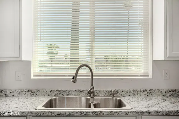 a close view of a sink and a window