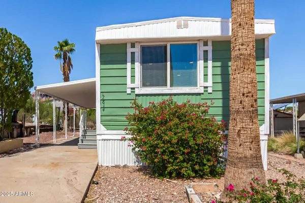 a front view of a building with garden