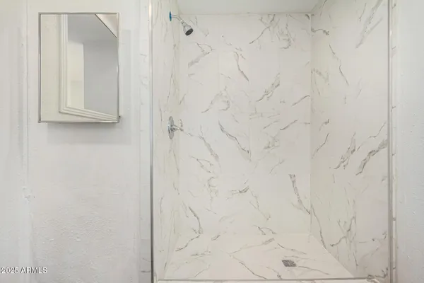 a bathroom with a white shower