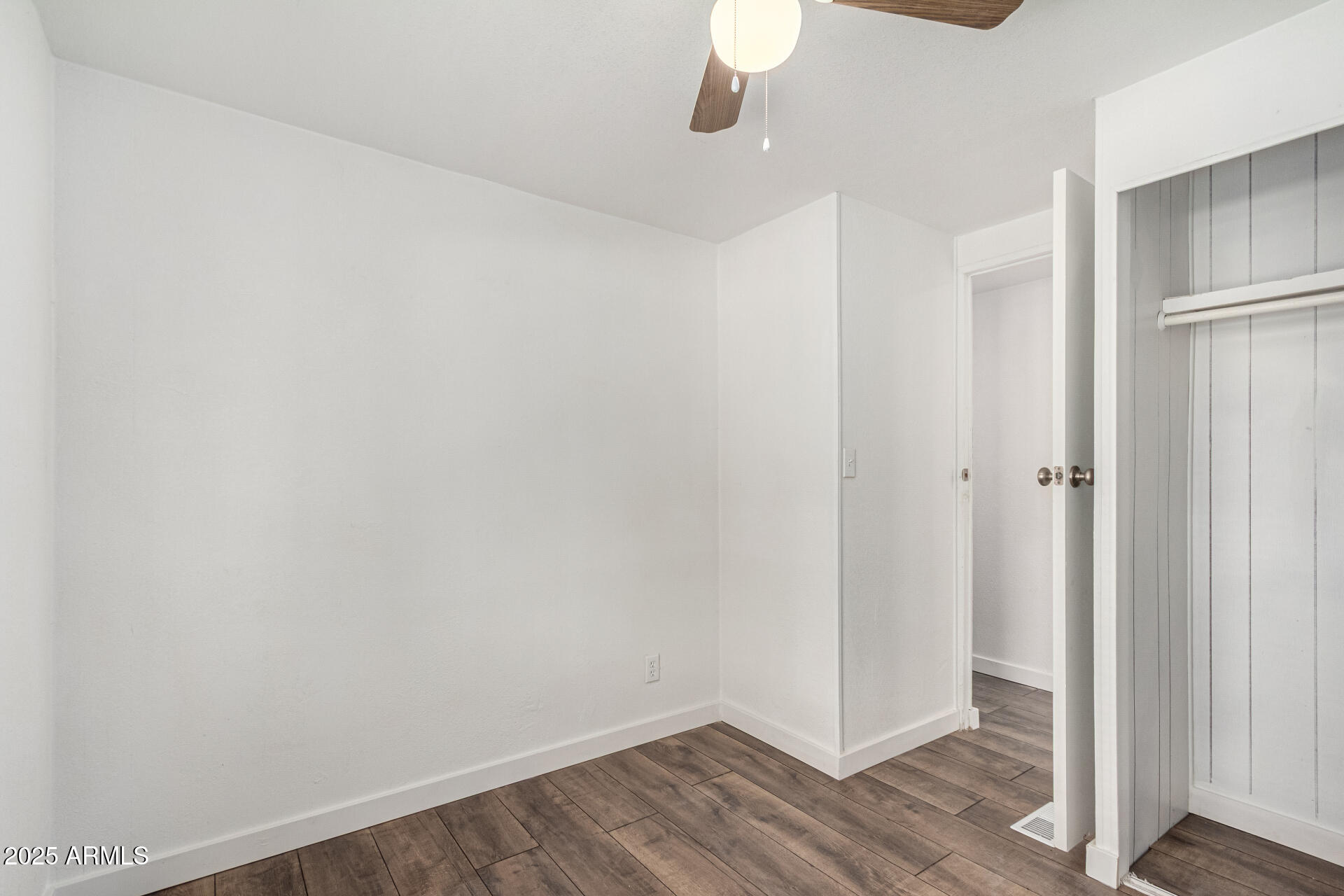 12814 North 19th Place, Unit 19 Phoenix, AZ 85022 - Photo 23 of 29 a view of a room with wooden floor