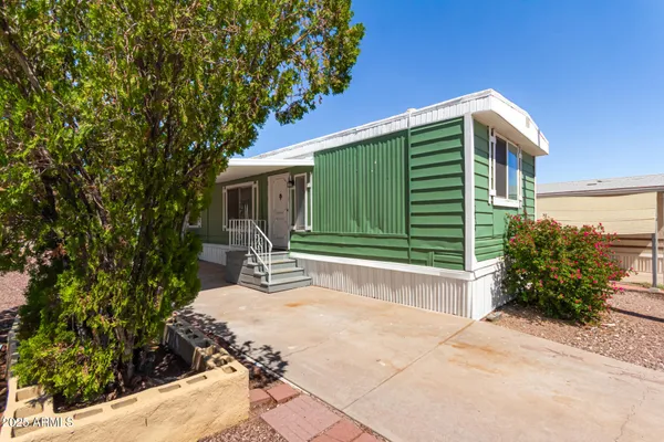 a house view with a backyard space