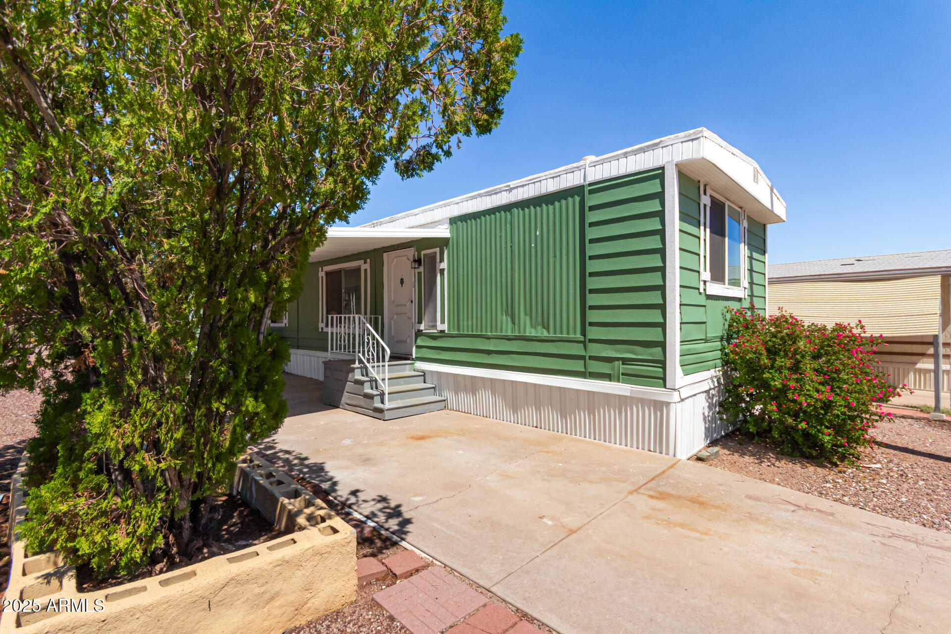 12814 North 19th Place, Unit 19 Phoenix, AZ 85022 - Photo 3 of 29 a house view with a backyard space