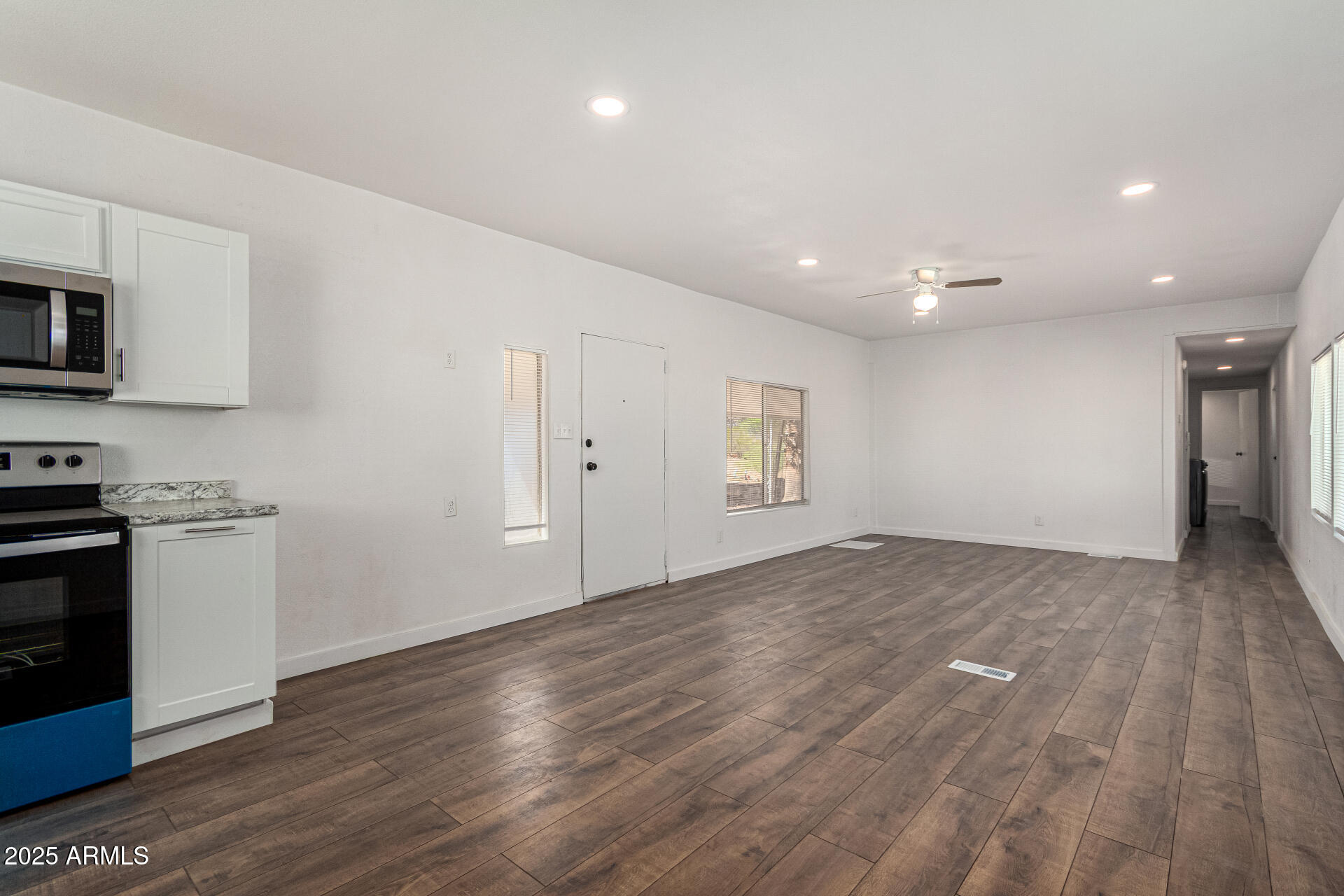 12814 North 19th Place, Unit 19 Phoenix, AZ 85022 - Photo 9 of 29 a view of a kitchen with a sink and a stove top oven
