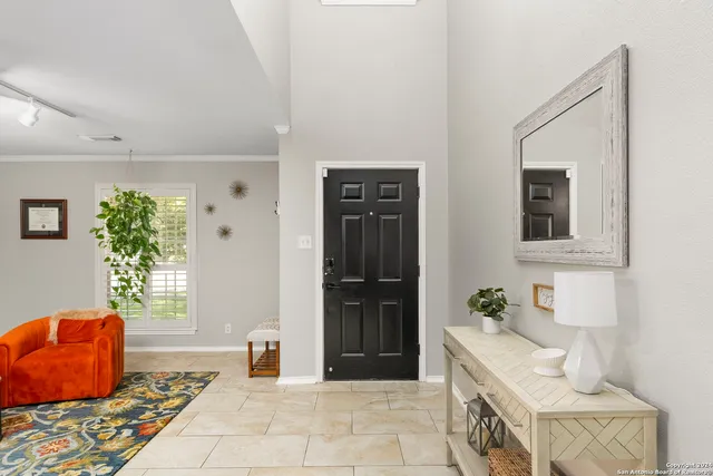 a bedroom with furniture and a window