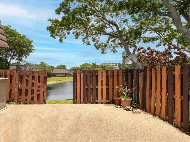 a view of a street with a tree in the background