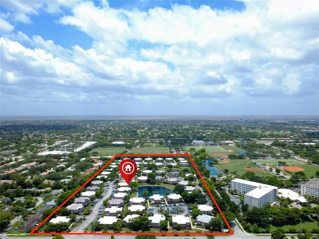 an aerial view of houses with outdoor space