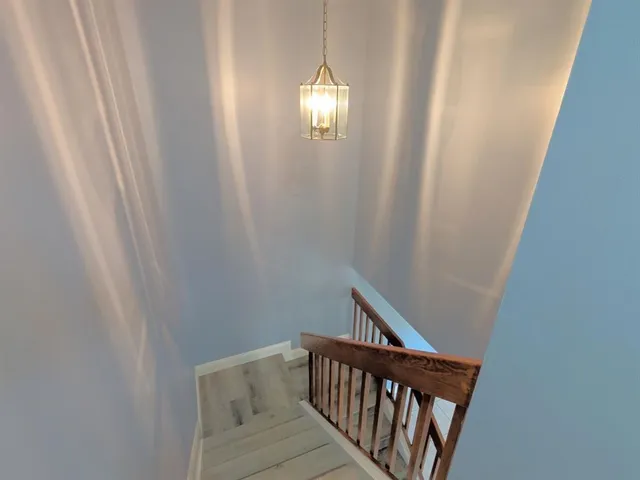 a view of a hallway with windows