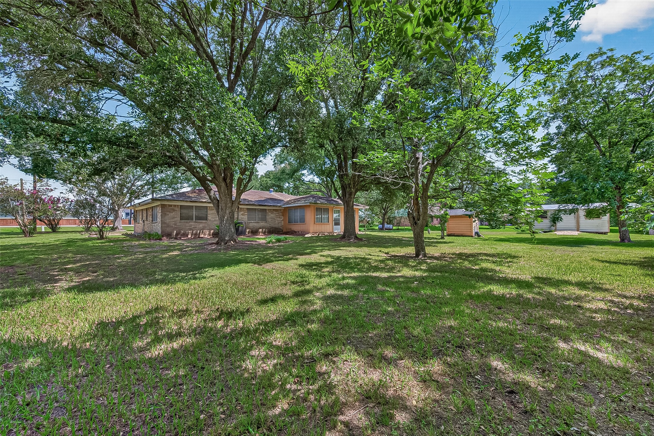11105 Needville Fairchilds Road Needville, TX 77461 - Photo 22 of 24 a view of a house with a big yard
