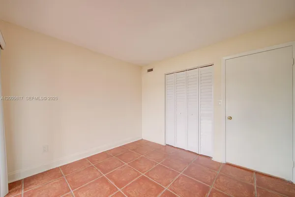 a kitchen with stainless steel appliances a stove a microwave a sink and cabinets