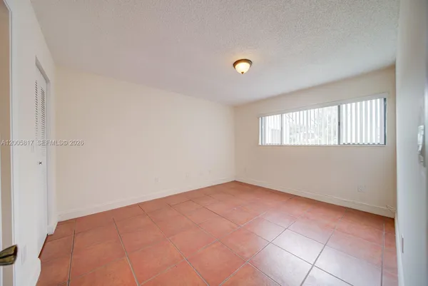 a view of an empty room and window