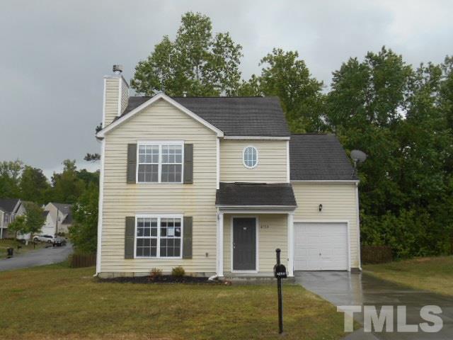 4180 Dalcross Road Raleigh, NC 27610 - Photo 1 of 12 a front view of a house with a garden