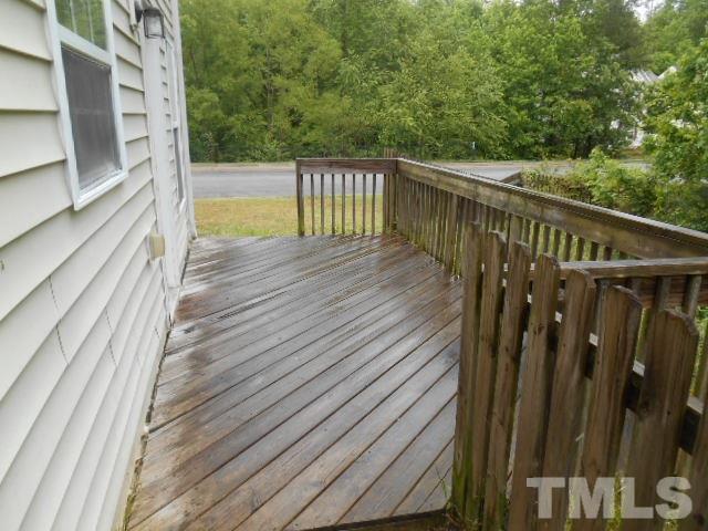 4180 Dalcross Road Raleigh, NC 27610 - Photo 3 of 12 a view of balcony with wooden floor and fence