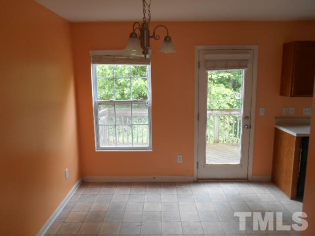 4180 Dalcross Road Raleigh, NC 27610 - Photo 6 of 12 a view of an empty room with a window