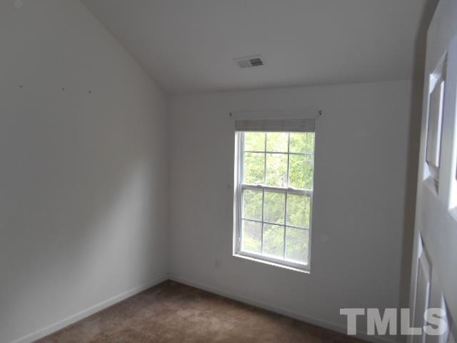 4180 Dalcross Road Raleigh, NC 27610 - Photo 8 of 12 an empty room with a window