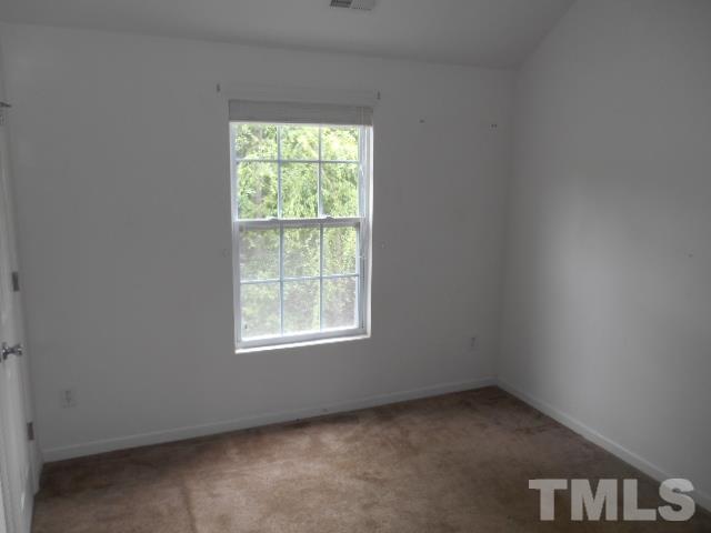 4180 Dalcross Road Raleigh, NC 27610 - Photo 9 of 12 an empty room with a window