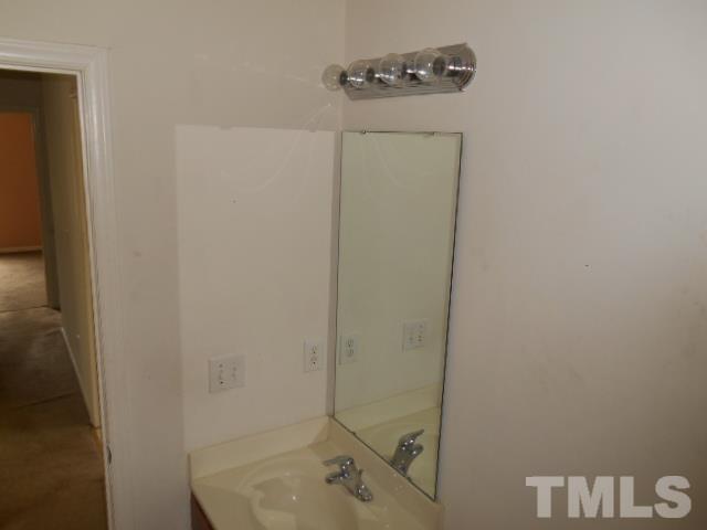 4180 Dalcross Road Raleigh, NC 27610 - Photo 10 of 12 a bathroom with a sink and shower