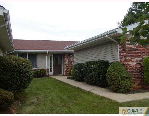 735 B Prospect Road Monroe Township, NJ 08831 - Photo 1 of 8 a front view of a house with a garden