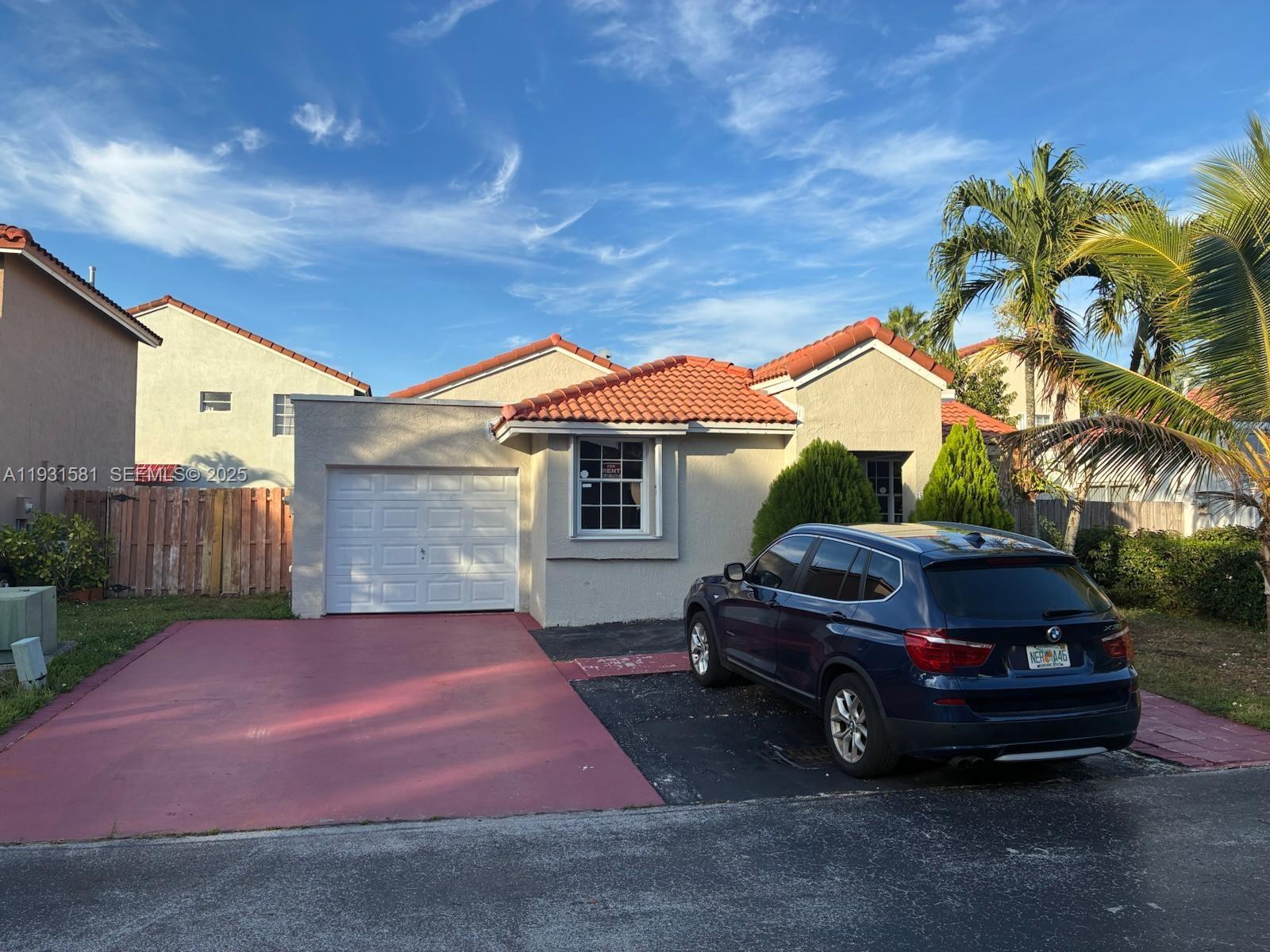 a car parked in front of a house
